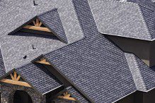 A close up of some roof shingles on a building